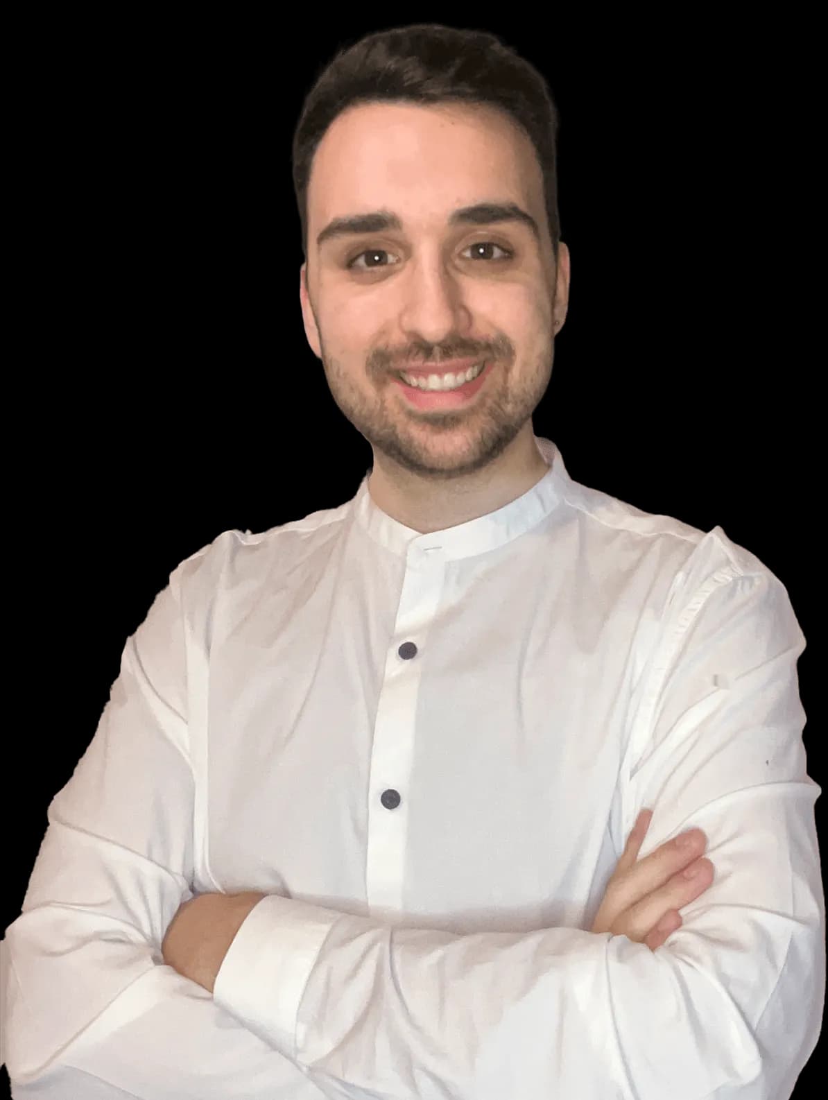 Luca Baldaccini, a braccia conserte, sorride